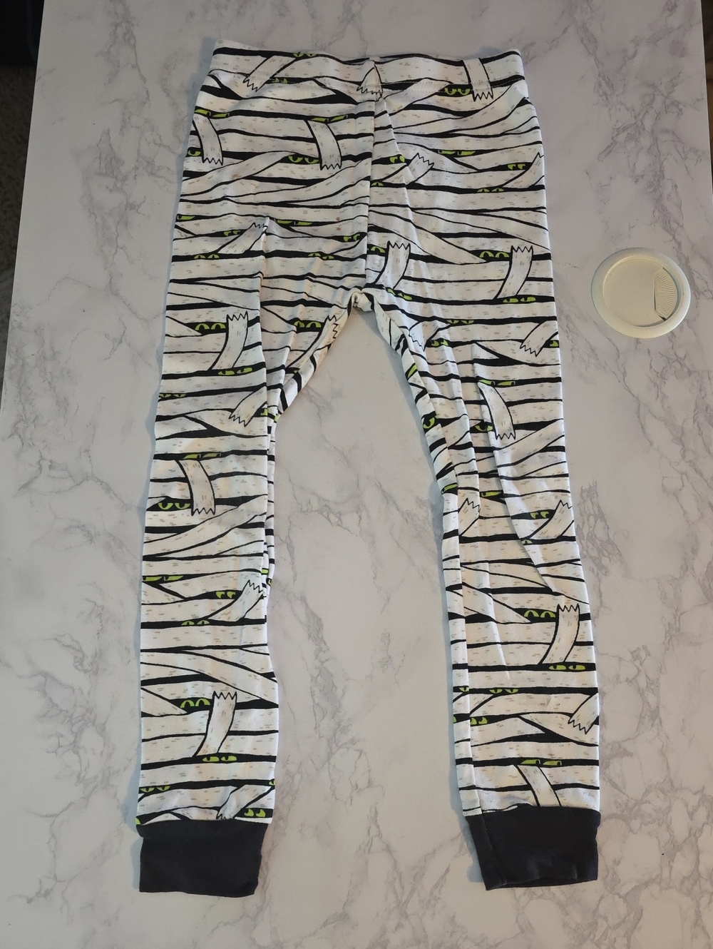 Old Navy White Striped Mummy Print Leggings with Green Eye Accents